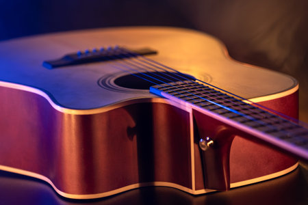 Close up of guitar and strings with shallow depth of field, soft focus.