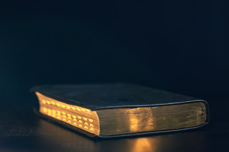Bible on a black background. Religion concept.の写真素材