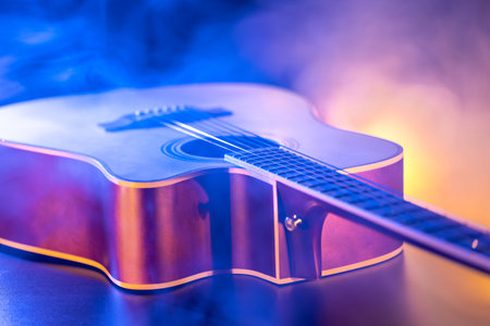 Close up of guitar and strings with shallow depth of field, soft focus.