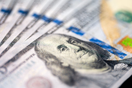 Close-up image of Benjamin Franklin on 100 bill. Finance concept.