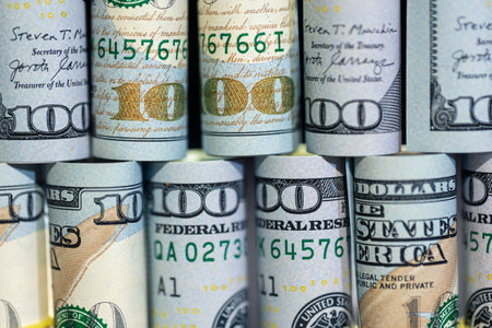 Close-up of twisted 100 dollar bills. Finance concept background.の写真素材