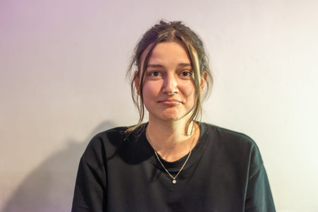 Portrait of a sad young woman. Sad woman on a light background.