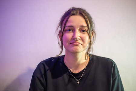 Portrait of a sad young woman. Sad woman on a light background.