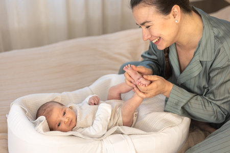 A young mother with a newborn baby. Newborn baby.の写真素材