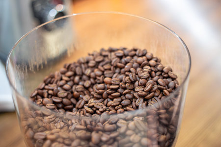Coffee beans in a coffee grinder. Coffee beans close-up.
