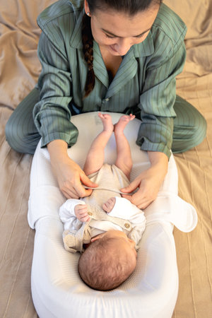 A young mother with a newborn baby. Newborn baby.の写真素材