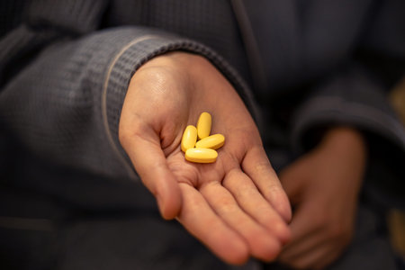 Pills in a womans hand. Health concept.