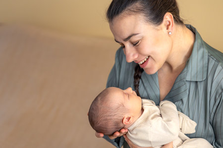 A young mother with a newborn baby. Newborn baby.の写真素材