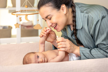 A young mother with a newborn baby. Newborn baby.の写真素材
