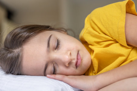 Calm beautiful girl sleeping in bed. Sleep concept. Calmly at home.の写真素材