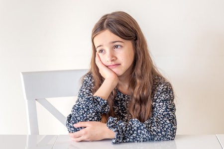 Sad girl. The girl has a sad emotion. Thoughtful girl.の写真素材