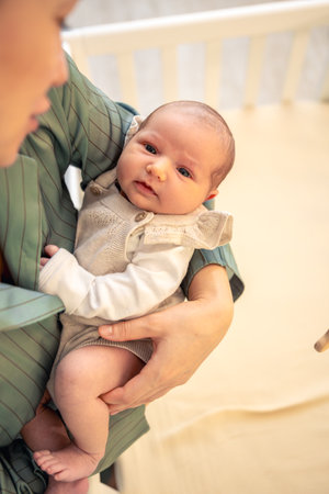A mother holds a newborn baby in her arms. Newborn baby.の写真素材