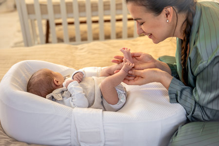 A young mother with a newborn baby. Newborn baby.の写真素材