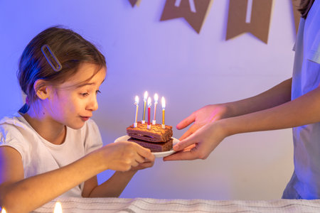 Birthday concept. Happy girl with a birthday cake.の写真素材