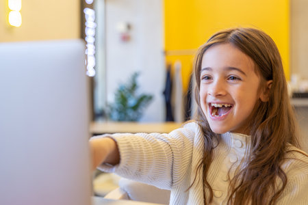 Surprised girl with laptop. Girl and laptop. Technology concept.の写真素材