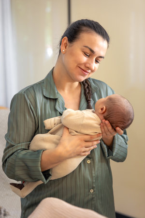 A young mother with a newborn baby. Newborn baby.の写真素材
