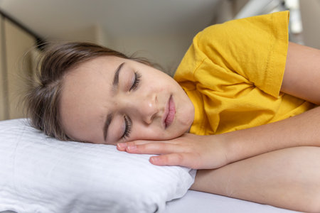 Calm beautiful girl sleeping in bed. Sleep concept. Calmly at home.の写真素材
