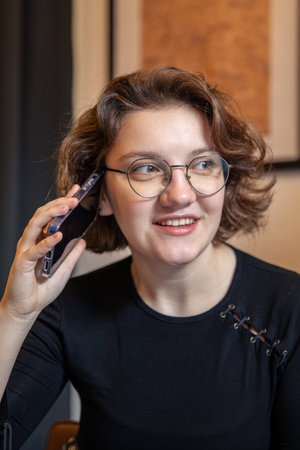 Happy young woman talking on the phone. Emotion concept. Close-up.の写真素材