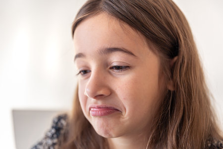 Sad girl. The girl has a sad emotion. Thoughtful girl.の写真素材