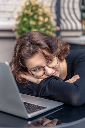Young woman working on laptop. Emotion concept.の写真素材