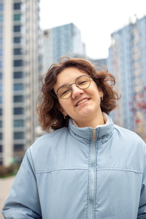 Portrait of a young woman in a big city. Woman in the city.の写真素材