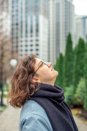 Young woman in a big city. Girl enjoying the city. Space for text.の写真素材