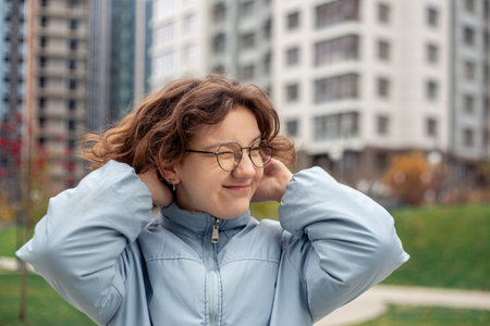 Portrait of a young woman in a big city. Woman in the city.の写真素材