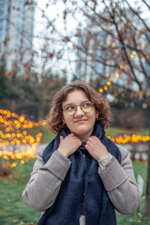 Portrait of a young woman in a big city. Woman in the city.の写真素材
