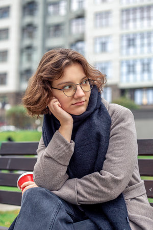 Portrait of a young woman in a big city. Woman in the city.の写真素材