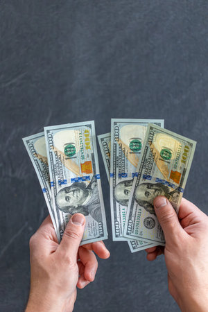Hand holding money. International currency. Exchange world money.