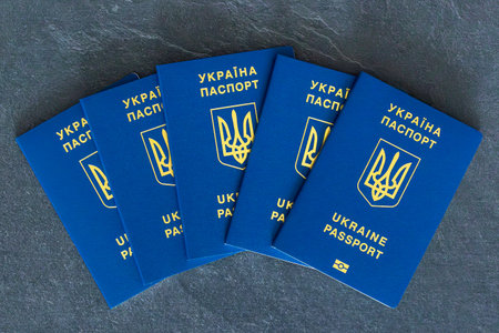 Ukraine passports stacked. Ukrainian biometric passport. Emigration concept.の写真素材