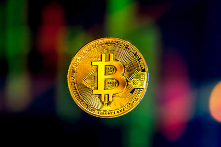 Bitcoin gold coin. Stock market trading chart background online candle.の写真素材