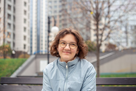 Portrait of a young woman in a big city. Woman in the city.の写真素材