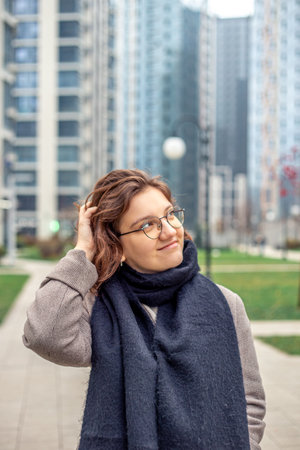 Portrait of a young woman in a big city. Woman in the city.の写真素材