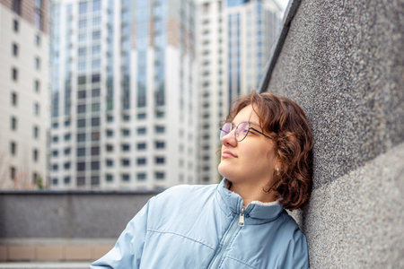 Young woman in a big city. Girl enjoying the city. Space for text.の写真素材