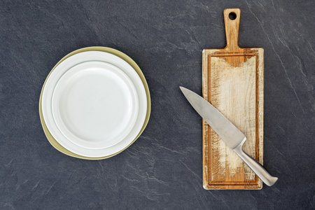 Wooden cutting board with knife top view. Cooking concept.の写真素材