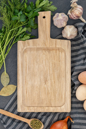 Background with ingredients for cooking and an empty cutting board. Ingredients for cooking.の写真素材