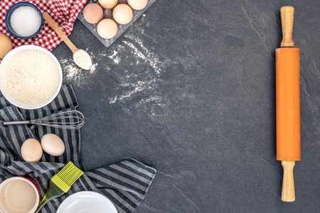 Baking background. Ingredients for baking cakes. Eggs, flour and rolling pin.の写真素材