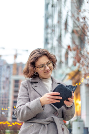 Young beautiful woman with wallet. Financial and investment concept.の写真素材