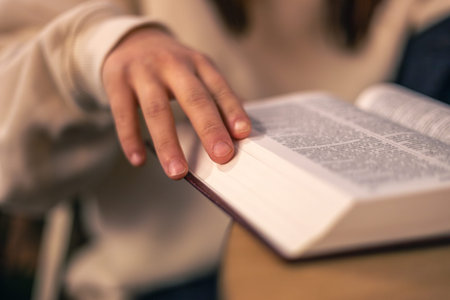 Bible close-up. Christianity concept. Reading the Holy Bible. Bible in womens hands.