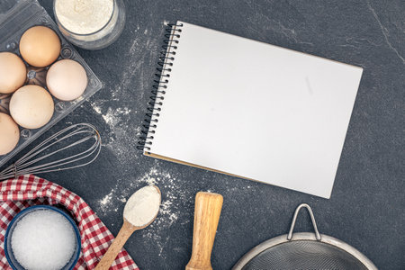 Background with baking ingredients and blank book. Baking ingredients.の写真素材