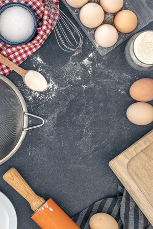 Baking background. Ingredients for baking cakes. Eggs, flour and rolling pin.の写真素材