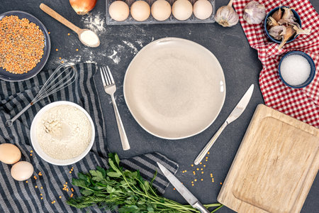 Flat lay cooking ingredients and empty plate. Background with cooking ingredients.の写真素材