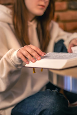 Bible close-up. Christianity concept. Reading the Holy Bible. Bible in womens hands.