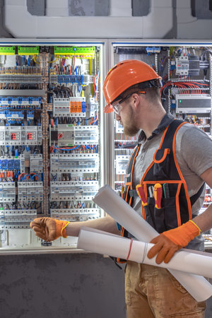 Male construction worker in overalls. Male electrician in overalls.の写真素材