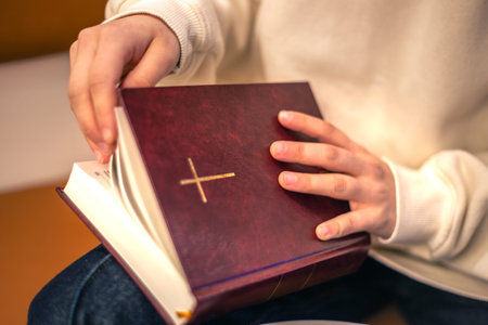 Bible close-up. Christianity concept. Reading the Holy Bible. Bible in womens hands.