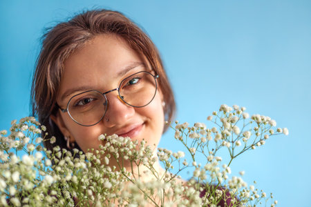 Young woman with a bouquet in her hands. Womens Day. Valentines Day.の写真素材