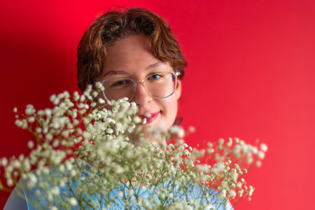 Young woman with a bouquet in her hands. Womens Day. Valentines Day.の写真素材