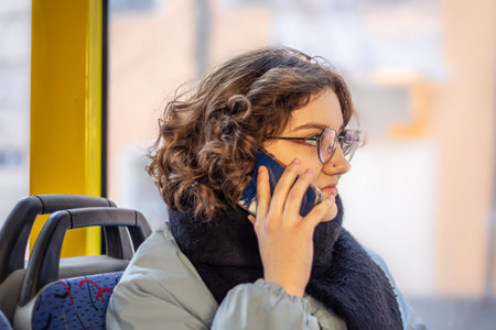 A female student rides public transport. Public transportation and people concept.の写真素材
