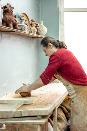Ceramicist-potter at work. Modeling from clay. Preparing for pottery.の写真素材